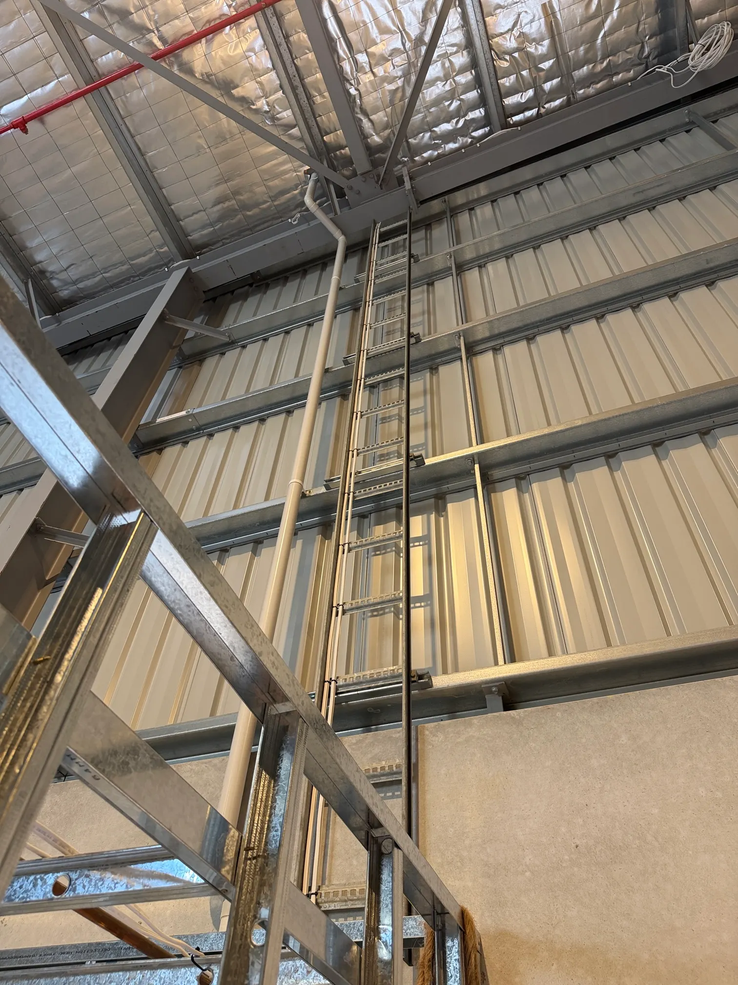 Cable ladder installed along a warehouse roof