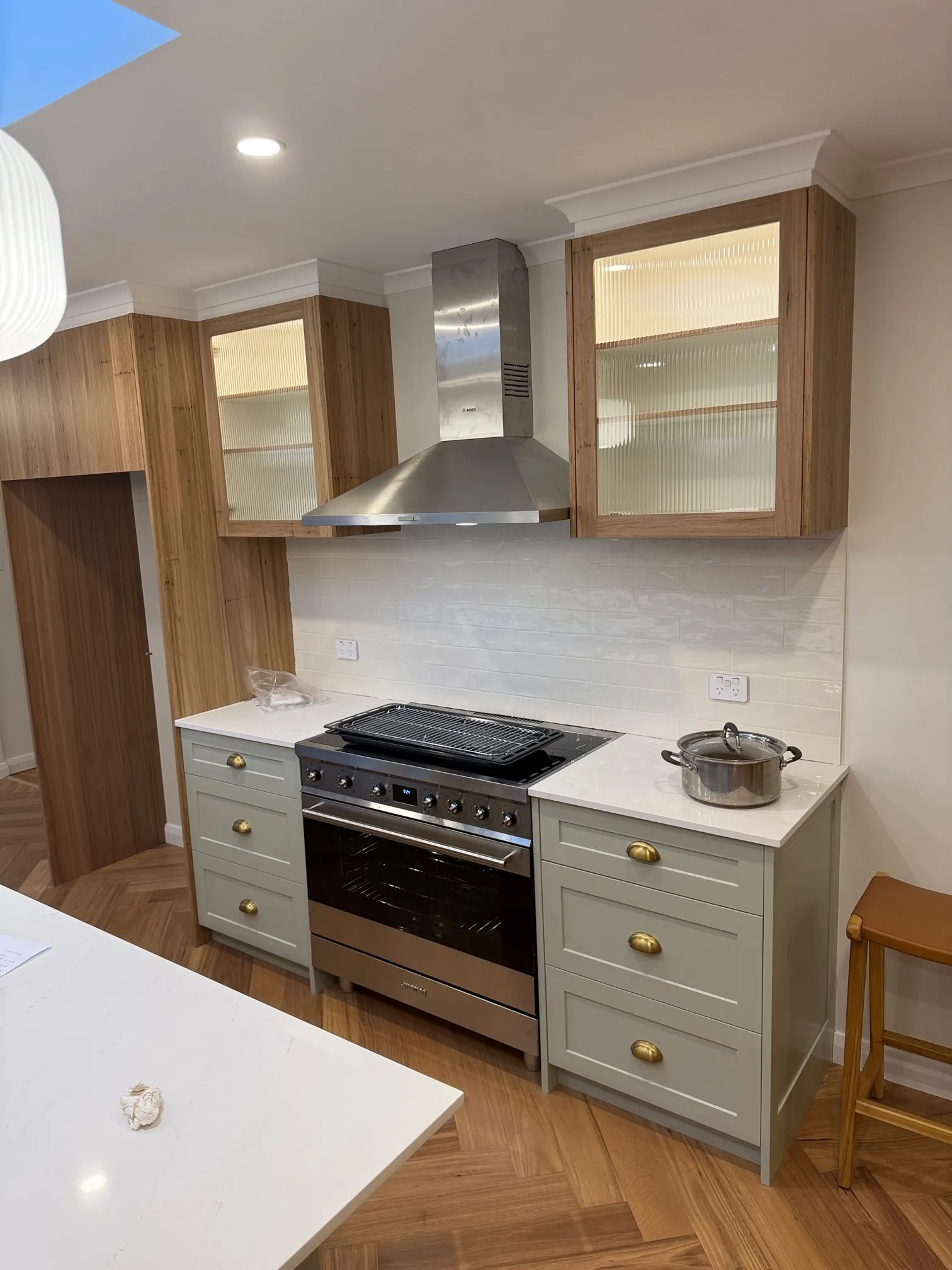 Kitchen with a newly connected oven and cooktop
