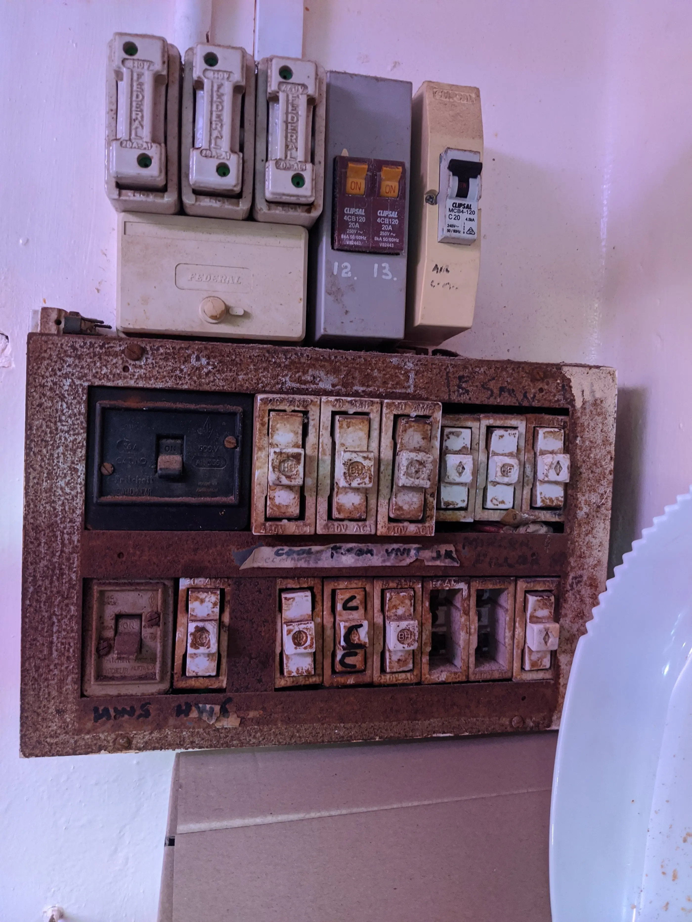Old fuse box with ceramic fuses, due for replacement