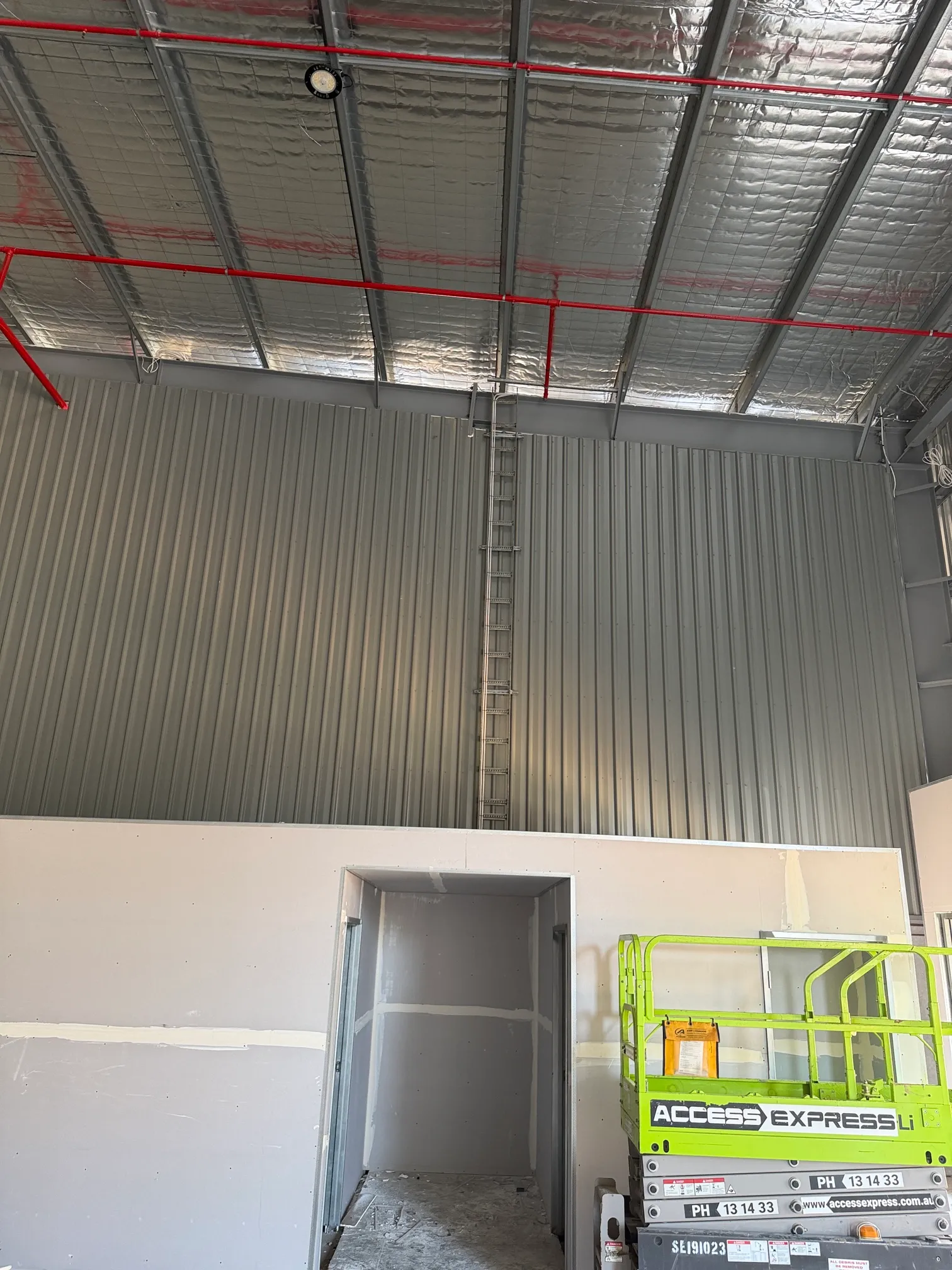 Warehouse wall with new cabling and conduit